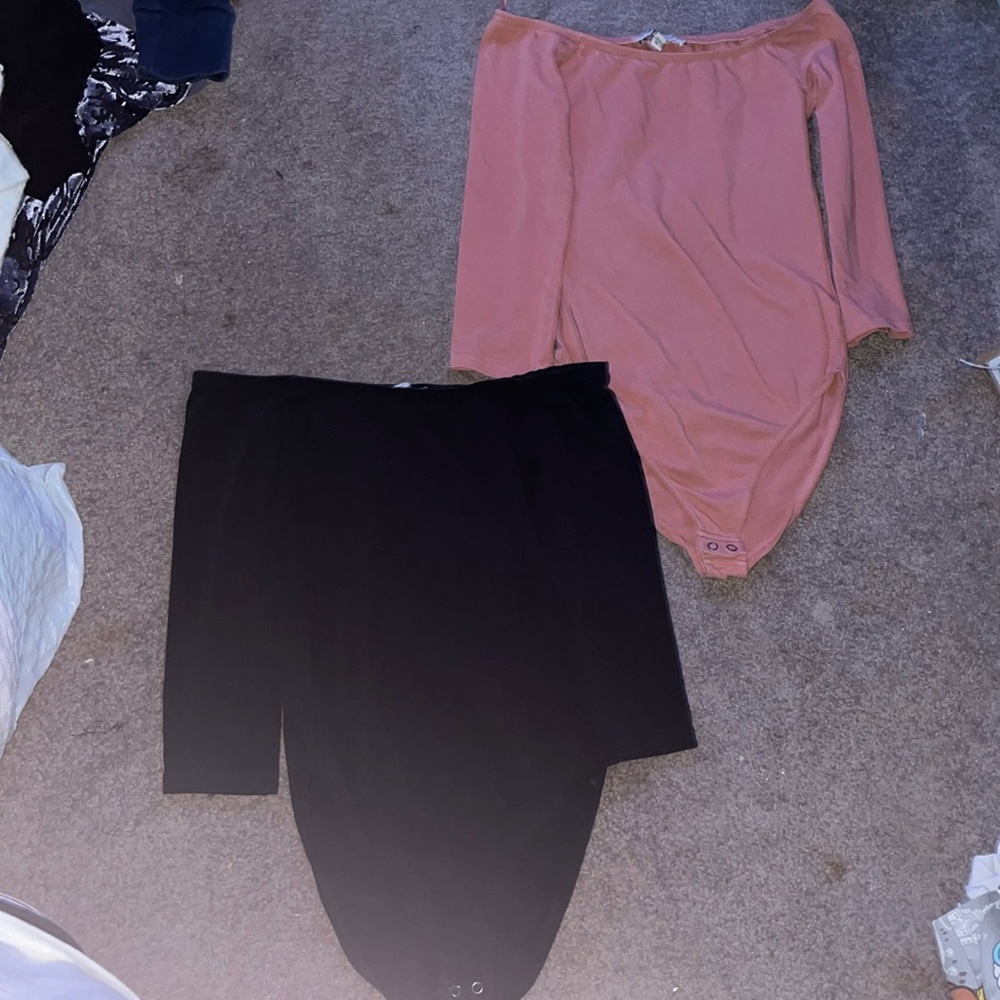 2 black and salmon pink body suits